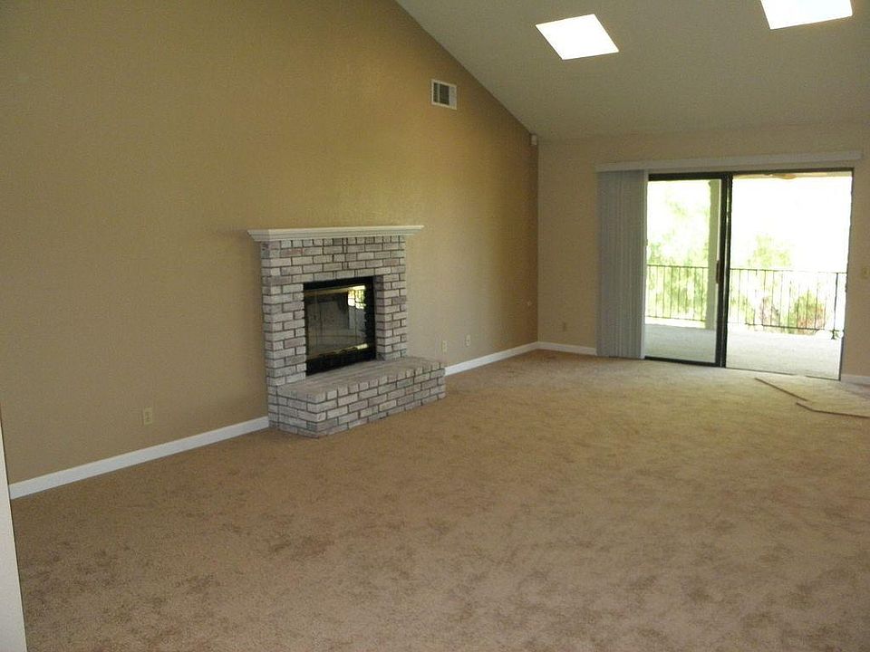 fire place with sky lights in living room