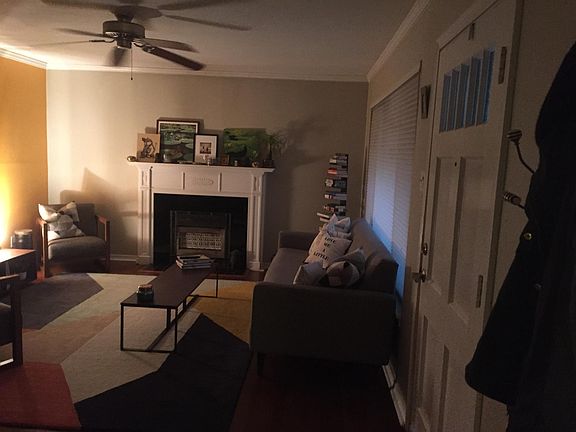 Living room - Large front window for lots of natural light in the daytime. Working vintage gas fireplace.