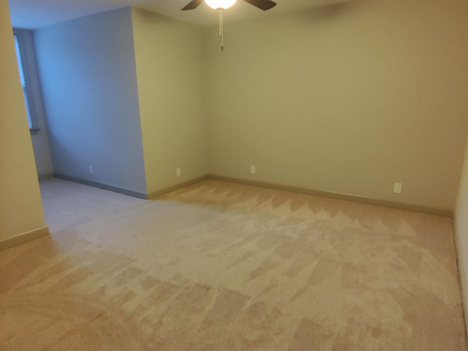 Room with an space perfect for a desk under a large window. New carpet and paint. Large WIC.