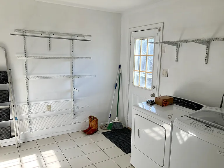 Laundry room withe bonus storage and direct access to the backyard.