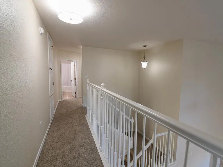 Master bedroom leading to secondary bedrooms