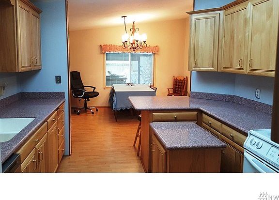 Nice updated kitchen with solid surface counters and nice cabinets.