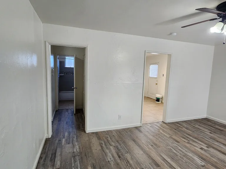 Living room with views to hallway and kitchen.