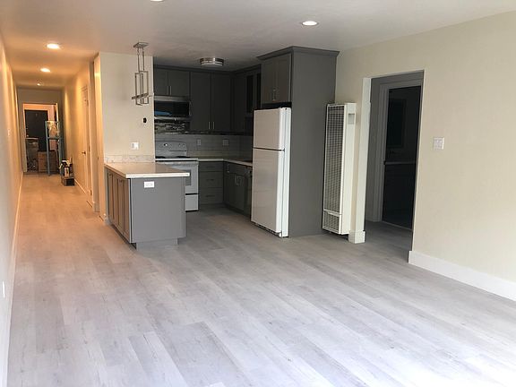 open common space layout (kitchen, living room, hallway entrance 2 hall closets)