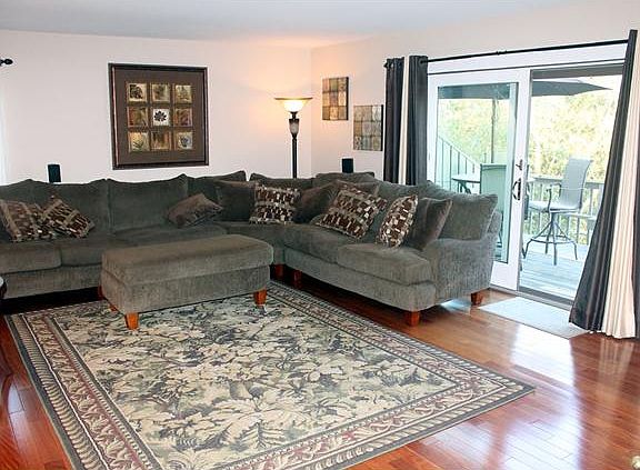 spacious room with slider to deck