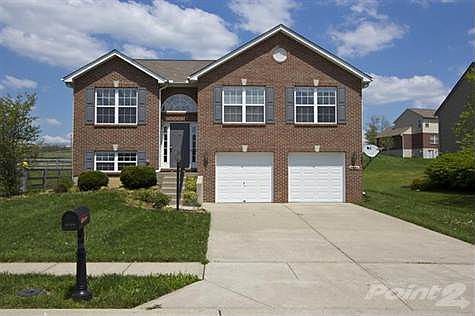 Front view offers a full brick exterior with double gables, large palladium window over front door to allow natural light to pour into the foyer.