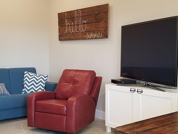 Recliner chair, sofa, plenty of storage space.