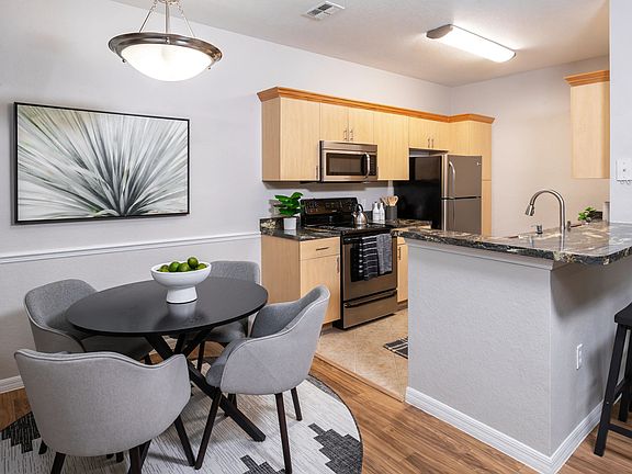 Enjoy an inviting open-concept kitchen and dining space, complete with a stylish breakfast bar.