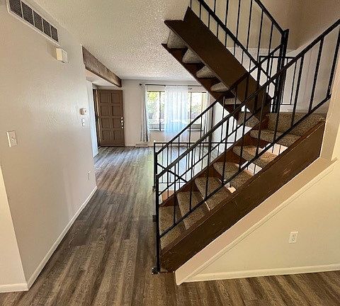 VIEW FROM DINING AREA TOWARDS LIVING AREA- NEW UPGRADED FLOORING