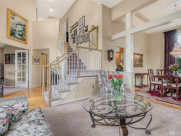 Wow- what an elegant entry to this home- opens to living & dining rooms with vaulted ceilings. 