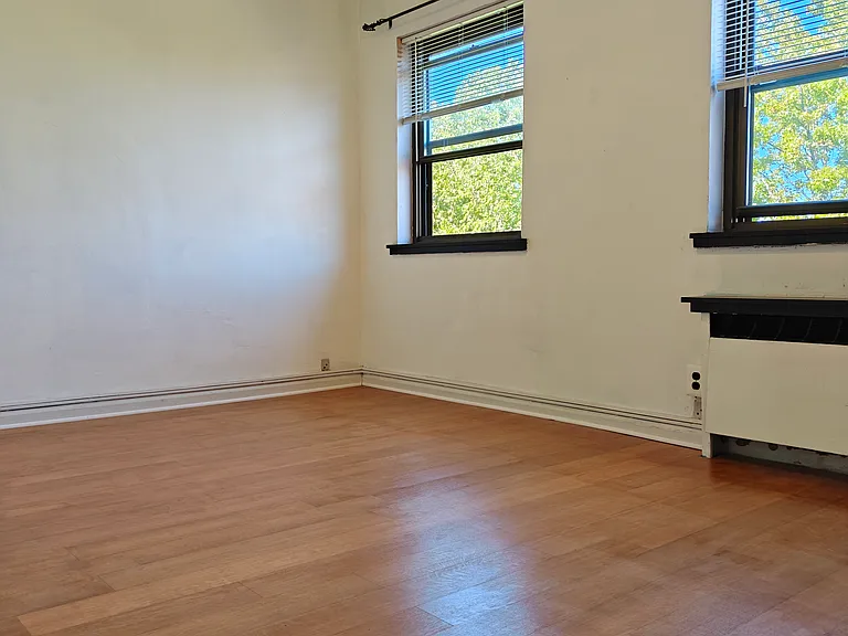 West facing bedroom freshly installed 5" wide hardwood flooring.