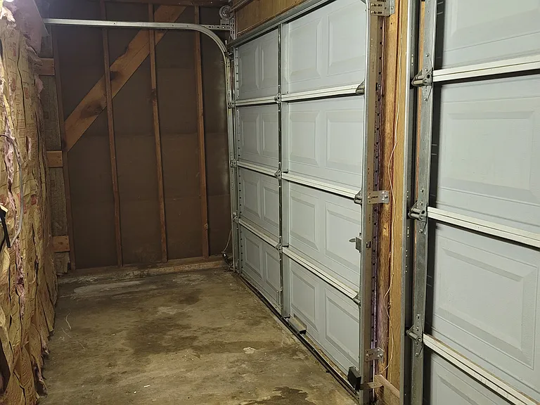 Small garage area still exists in former double door area of garage for storage/tools.