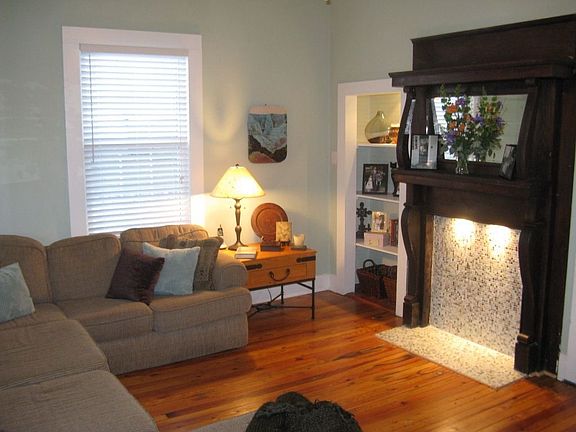 The antique oak mantel is the centerpiece of our living room