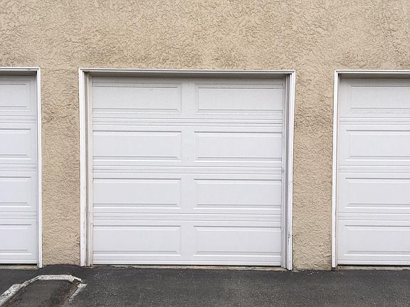 1 assigned parking space in a shared garage.  garage door op