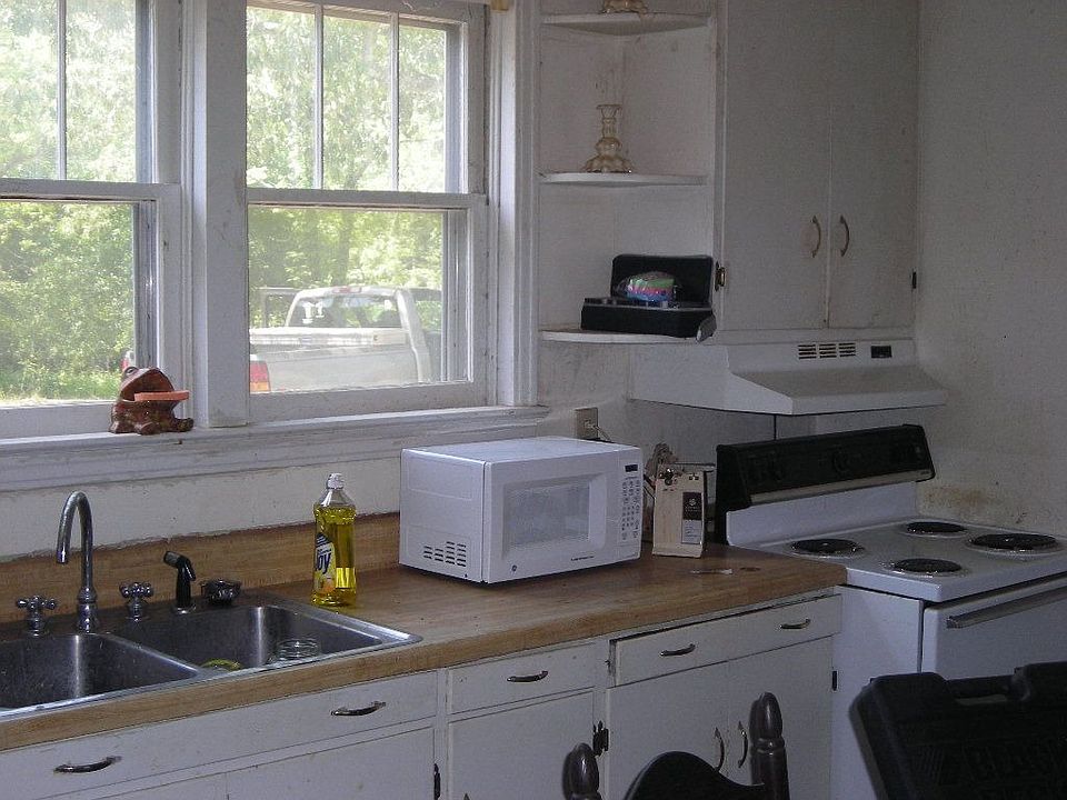 View of kitchen with white cabinets