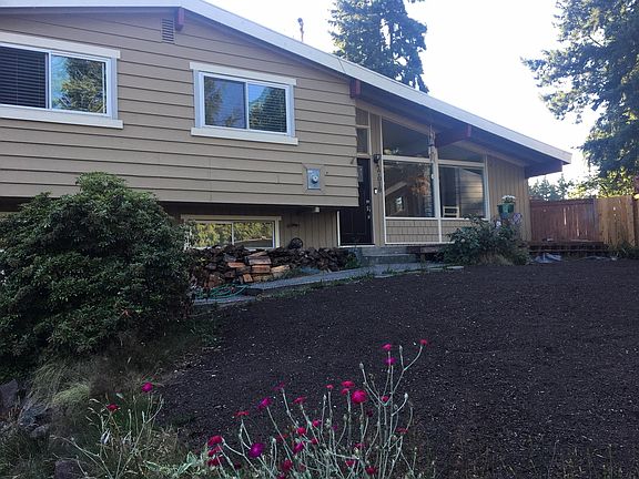 front of house (the door is the upstairs tenants and your private entry is on the side of the home near the garage).