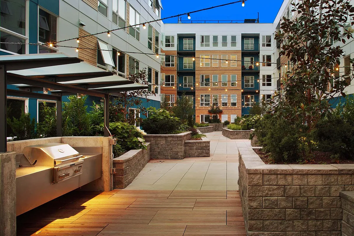 Unwind in the serene courtyard, a peaceful outdoor space perfect for relaxation or enjoying the fresh air in a quiet, charming setting. - Windsor Ballard