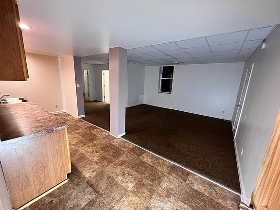 Initially walking in to the apartment. Kitchen to the left and living room straight ahead