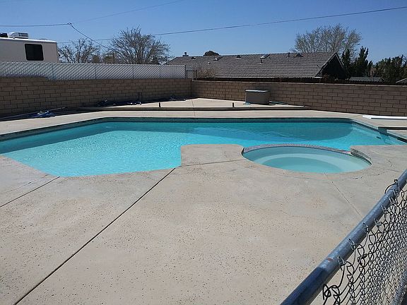 Pool with Jacuzzi fenced in