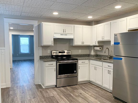 Brand New Kitchen w/White Cabinetry, Granite Counters, New Stainless Steel Refrigerator, Oven, Sink plus Garbage Disposal.