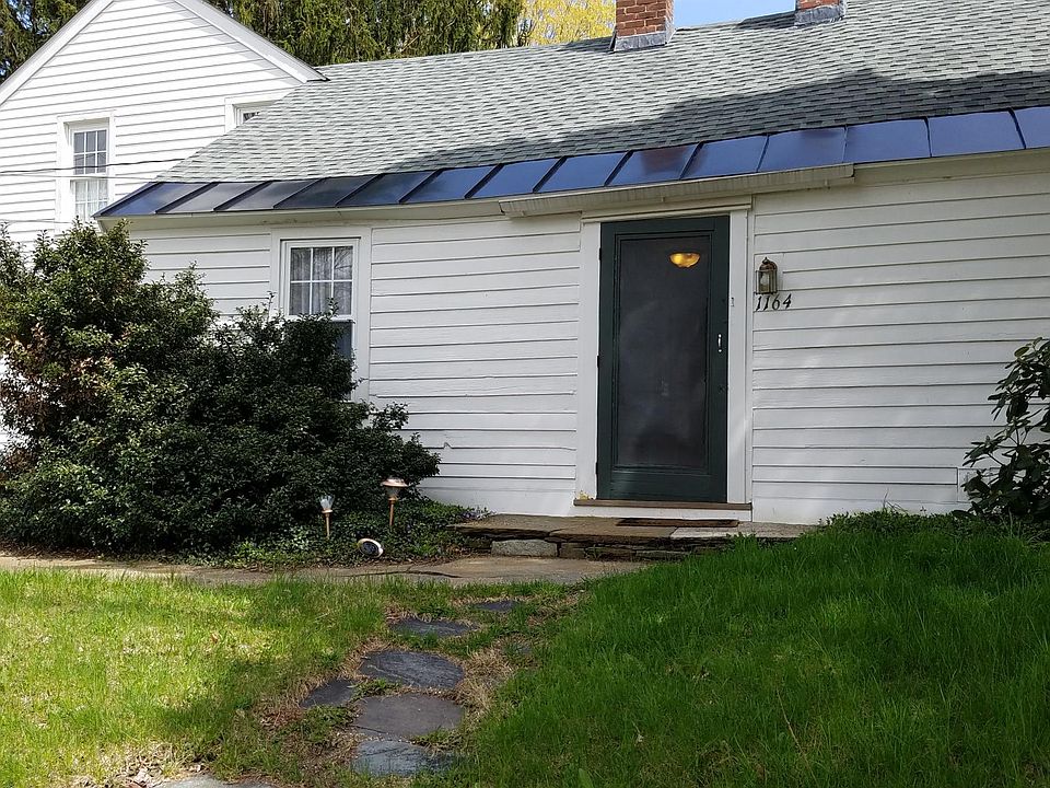 Circa 1795 renovated 10-room Cape on one acre with mature landscaping.