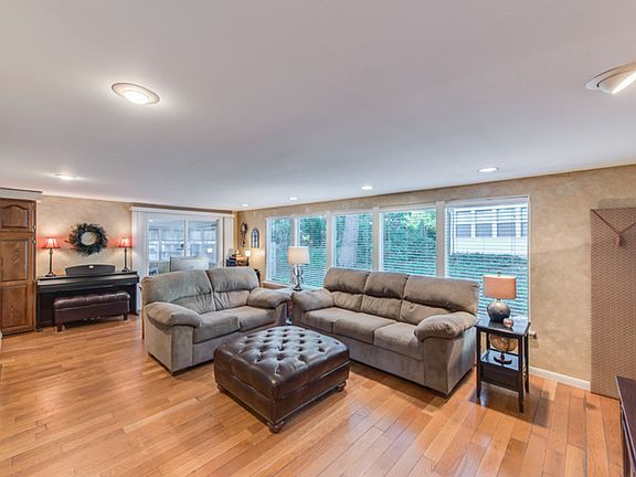 Another view of the living room with lots of windows.