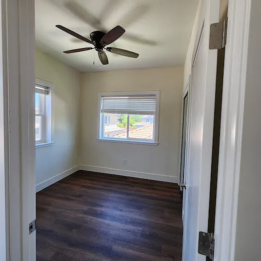 Bedroom #1 with a closet with mirror doors on right wall in the 2nd story.