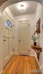 Entry Foyer with Beautiful Hardwood Floor and Coat Closet
