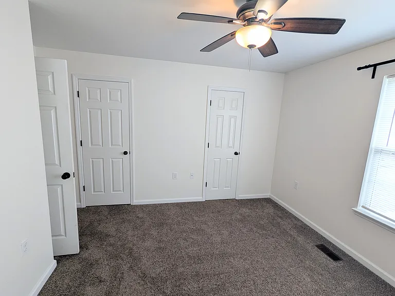 Master bedroom with walk-in closet and bathroom