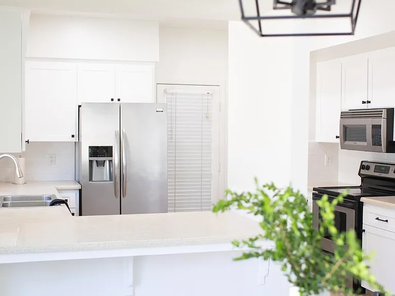 Kitchen filled with glassware, plates, silverware, utensils, in door bbq etc