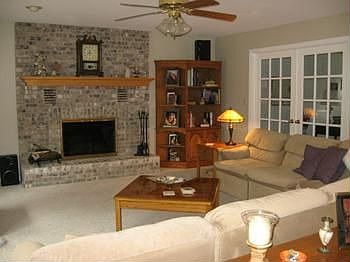 A heatilator included for woodburning fireplace in this spacious family room & French doors