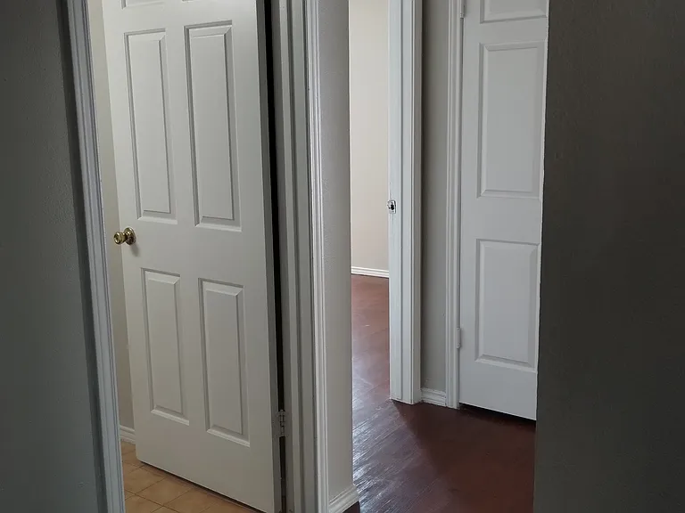 Hallway to both bedrooms/Restroom