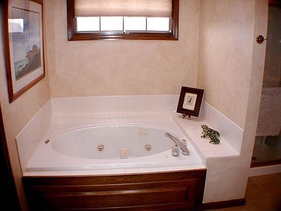 Master bath w/whirlpool tub and dble sinks.