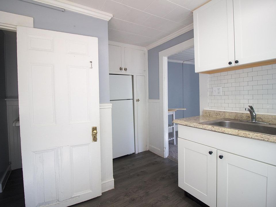Updated kitchen! New cabinets, stove hood, lights, floors, and custom moveable kitchen island.
