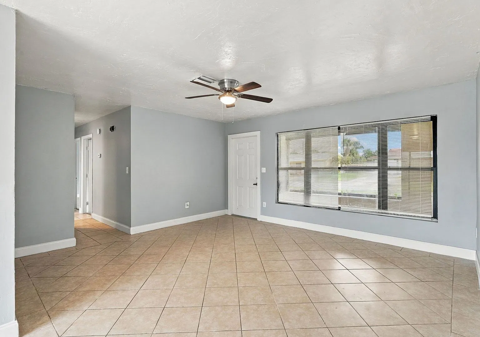 Freshly Painted 3-Bedroom, 2-Bathroom Home with Spacious Kitchen, Fenced Yard & Carport — Photo 3