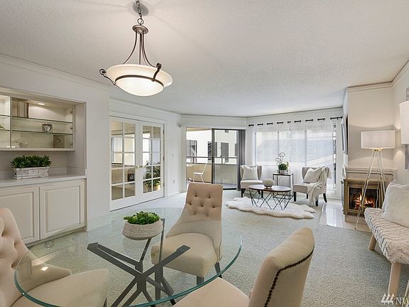 Open Great room with wine bar and cozy gas fireplace & sunlit rooms
