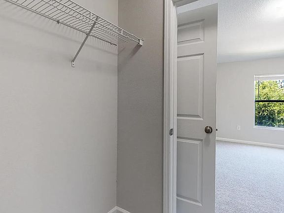 Walk-in closet in primary suite