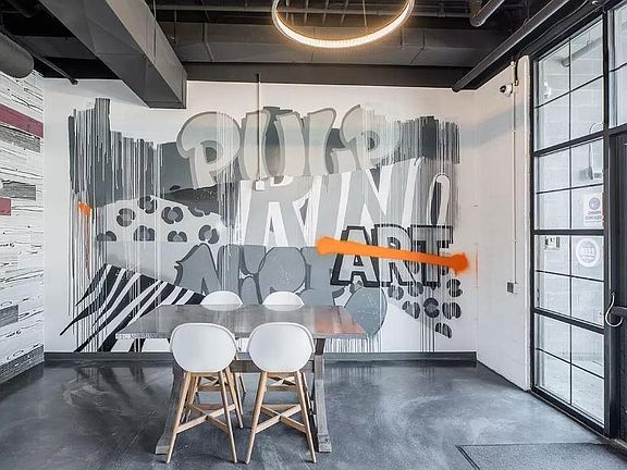 Lobby keeping with graffiti theme of neighborhood