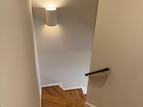 Looking downstairs from the upstairs bedroom area