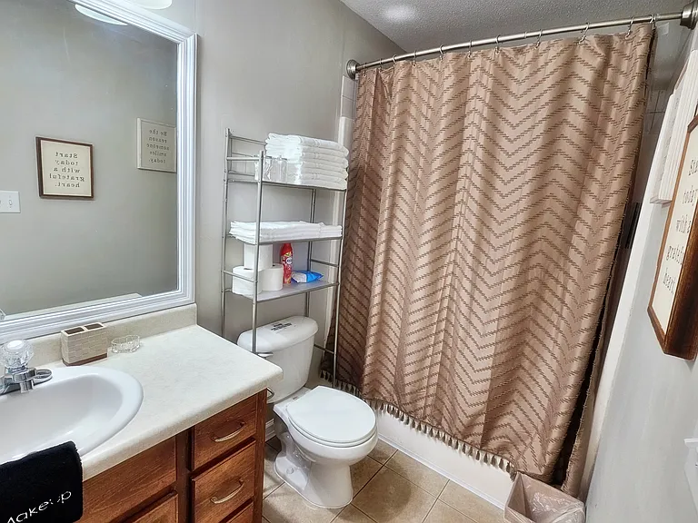 A full-size bathroom attaches to the main room. It contains all your necessities and a little extra.