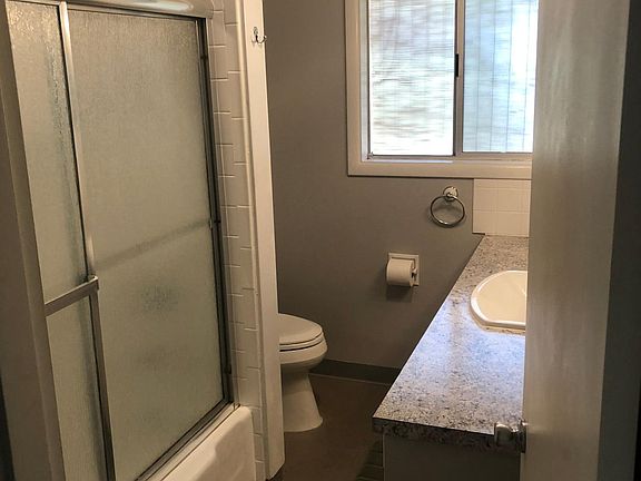 Decent size bath with shower, tub and large cabinet for stor