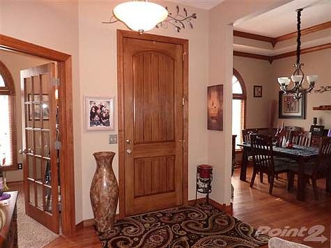 Beautiful solid wood door marks the entry to this lovely home with quality throughout. All doors are