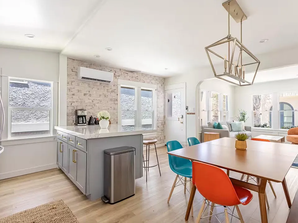 Top floor - Open floor plan with living, dining, and kitchen.