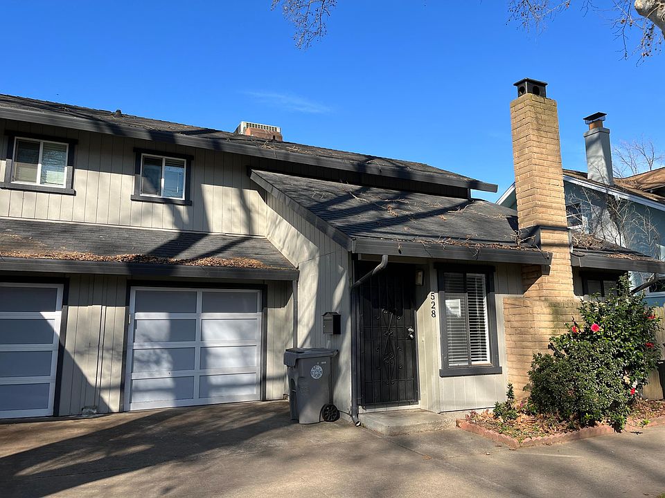 Duplex with newer garage door and opener