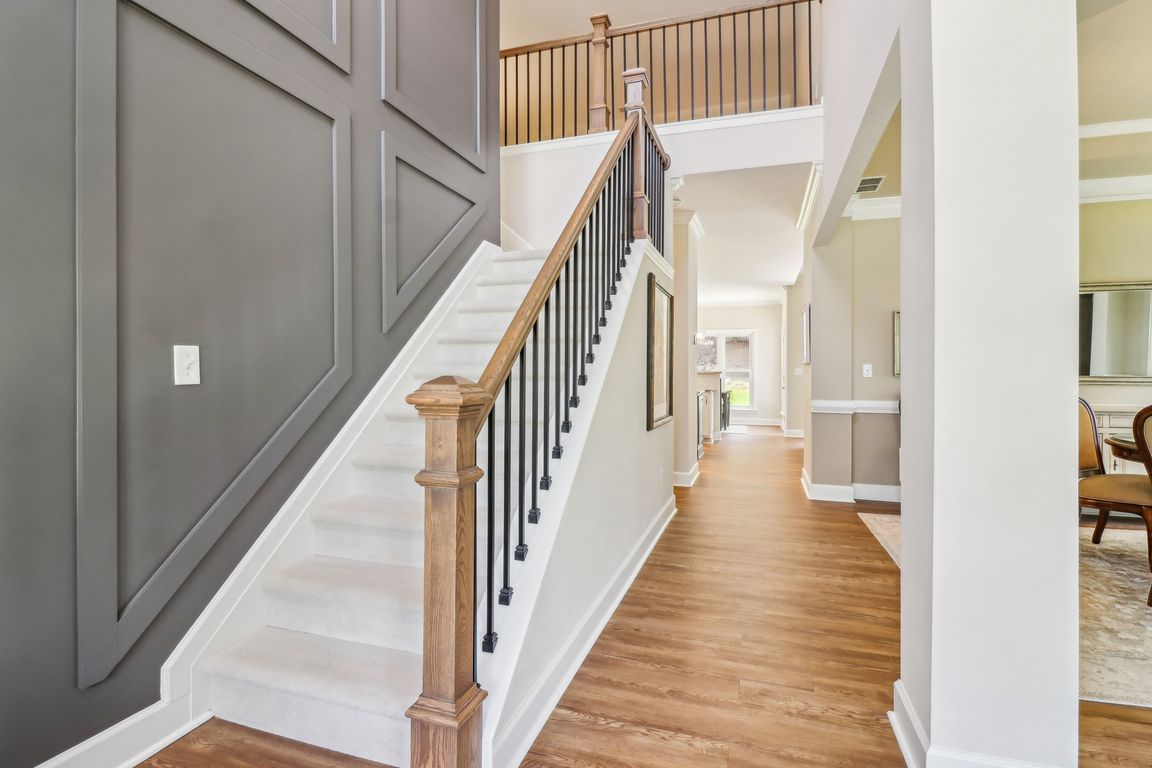 Impressive 2-Story Foyer with Accent wall with new Stair Posts and Spindles