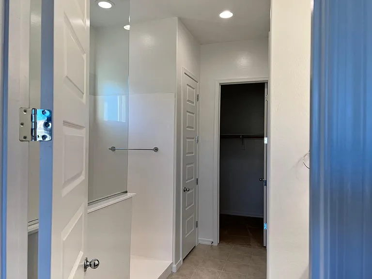 Shower on left, closet at back