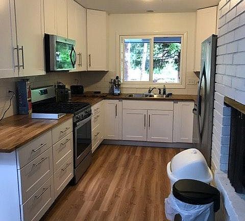 Kitchen with Fireplace separating Living and Kitchen