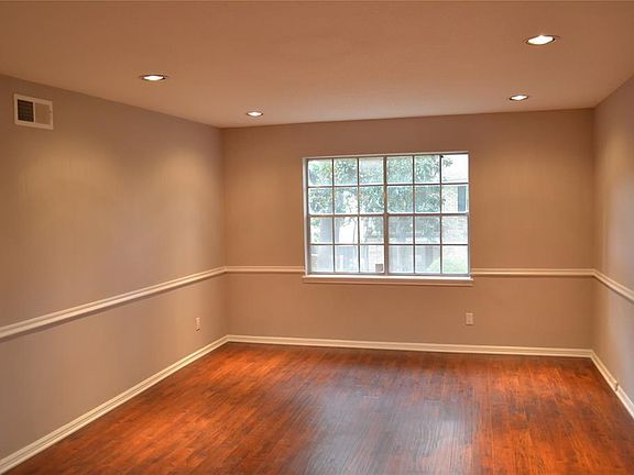 Living area with recessed lighting and natural light