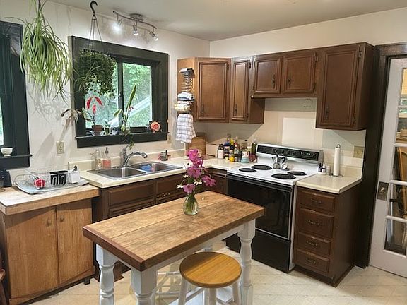 Kitchen and a glimpse of the Laundry room/door to the back yard.