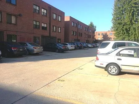 The parking lot has 69 parking spots. There are two entrances-- one on 12th Street, and the other on 13th Street. You will be able to see your car from your bedroom windows.